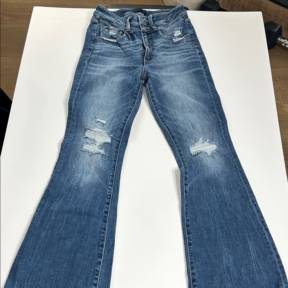 Buckle Flare Jeans in Distressed Blue